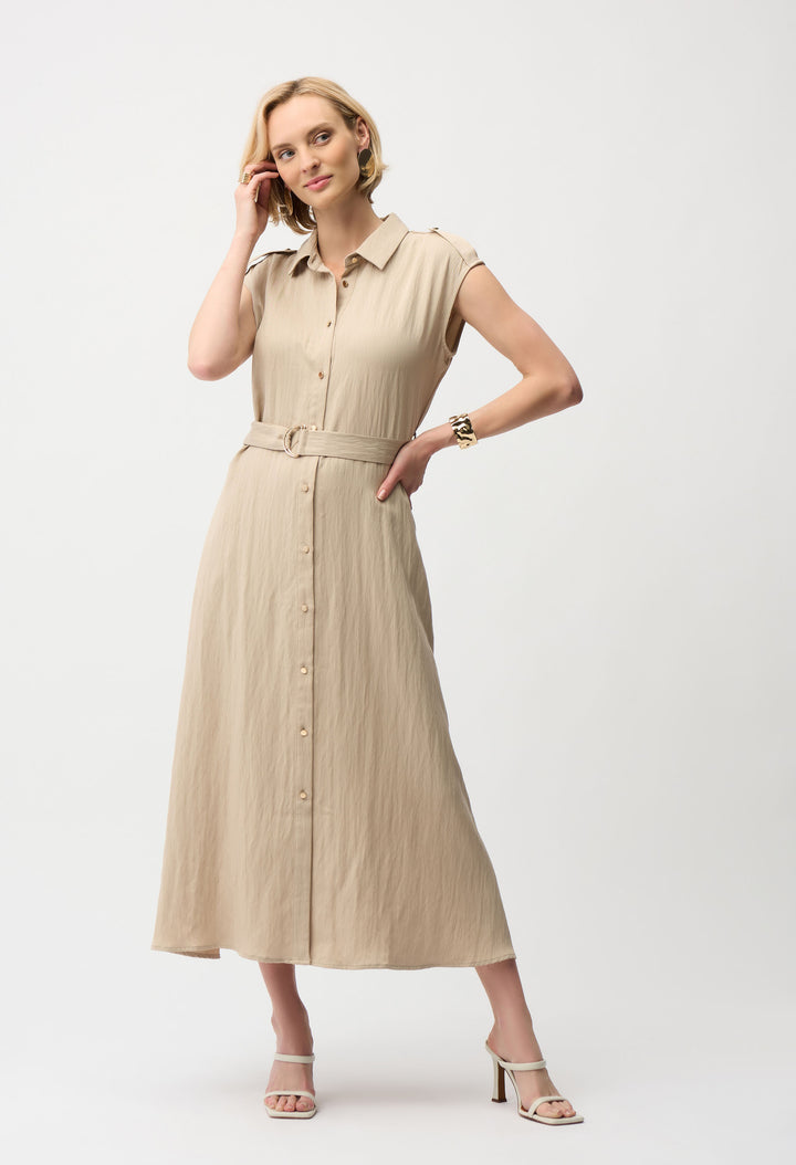 Woman wearing a beige dress on a white background