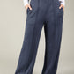 Navy wide-leg pants worn by a person on a plain background