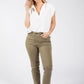 Woman wearing a white blouse and green pants on a white background