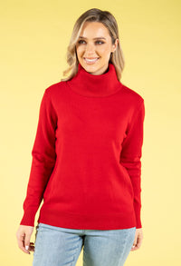 Woman wearing a red turtleneck sweater against a yellow background