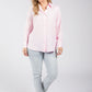 Woman wearing a pink shirt and light blue jeans on a white background