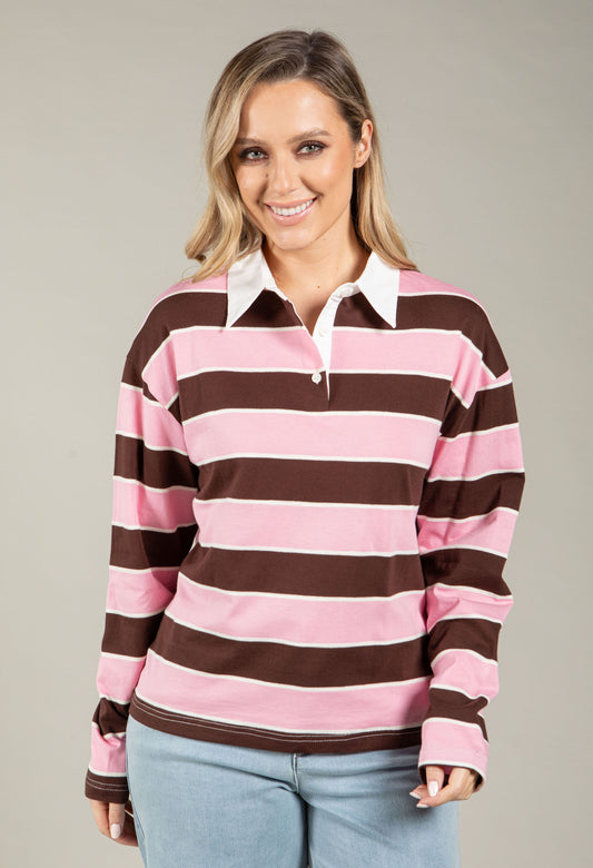 Woman wearing a red and white striped long-sleeve shirt against a plain background