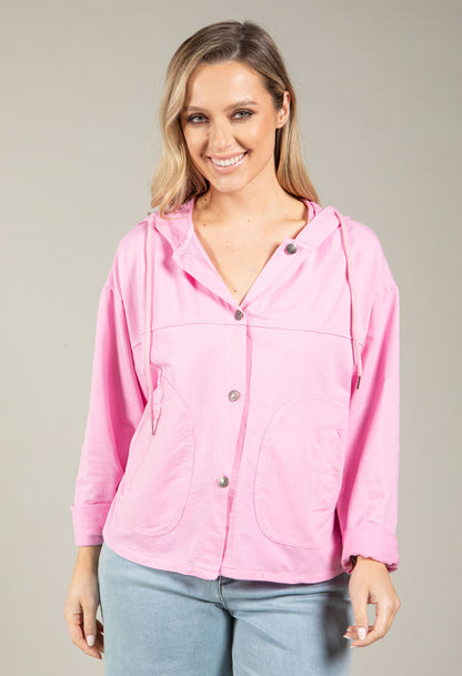 Woman wearing a pink jacket on a gray background