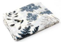 Folded fabric with floral pattern on a white background