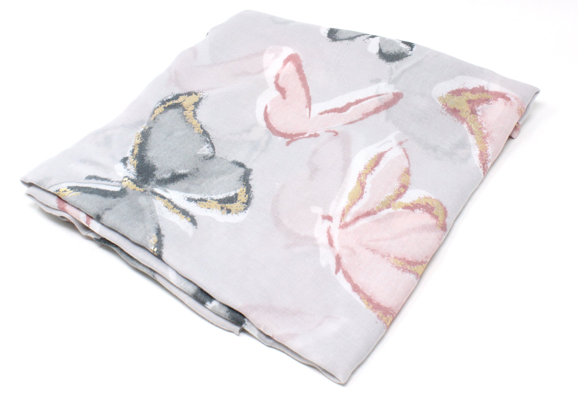 Floral and butterfly patterned fabric on a white background
