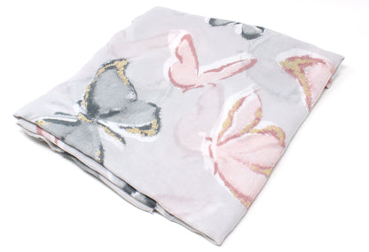 Floral and butterfly patterned fabric on a white background