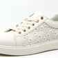 beige platform trainer with daisy design