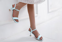 Low heel with a slim heel and adjustable ankle strap