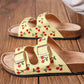 Lemon yellow sandals with embroidered cherry design, double straps and gold buckles
