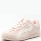 Pink sneaker with a white sole on a white background