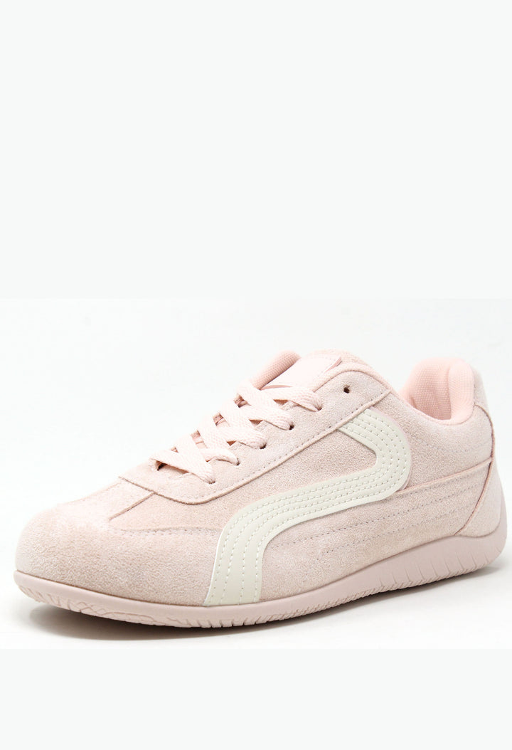 Pink sneaker with a white sole on a white background