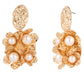 Gold earrings with pearl-like stones on a white background