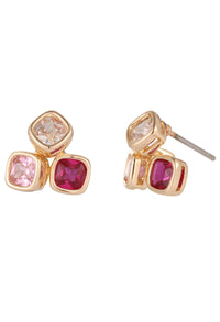 Gold earrings with pink and red gemstones on a white background