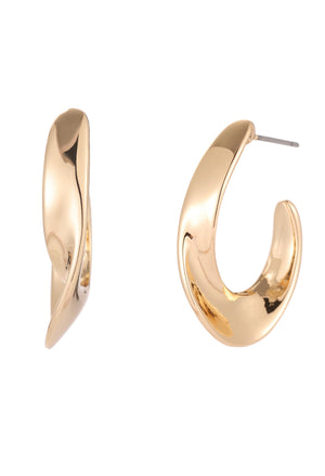 Gold hoop earrings on a white background
