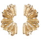 Gold leaf-shaped earrings on a white background