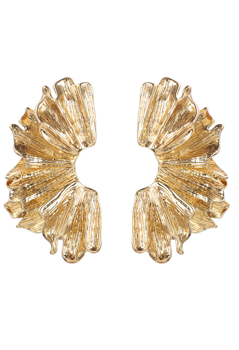 Gold leaf-shaped earrings on a white background