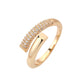 Gold ring with diamond accents on a white background