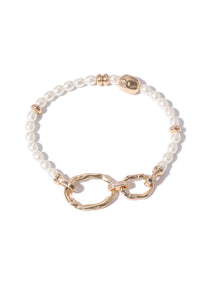 Bracelet with white beads and gold accents on a white background