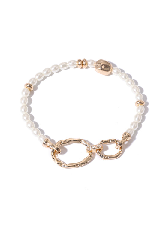 Bracelet with white beads and gold accents on a white background