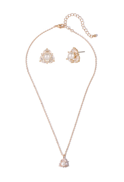 Rose gold necklace and earrings set on a white background