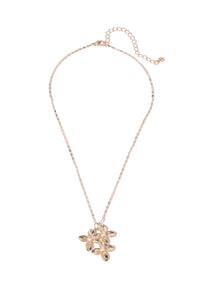 Gold necklace with a floral pendant on a white background