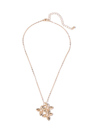 Gold necklace with a floral pendant on a white background