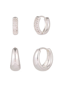 Set of silver hoop earrings on a white background