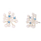 Pair of pearl earrings with blue gemstones on a white background