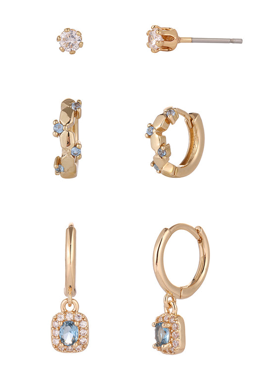Set of gold hoop earrings and a pair of gold hoop earrings with gemstones on a white background