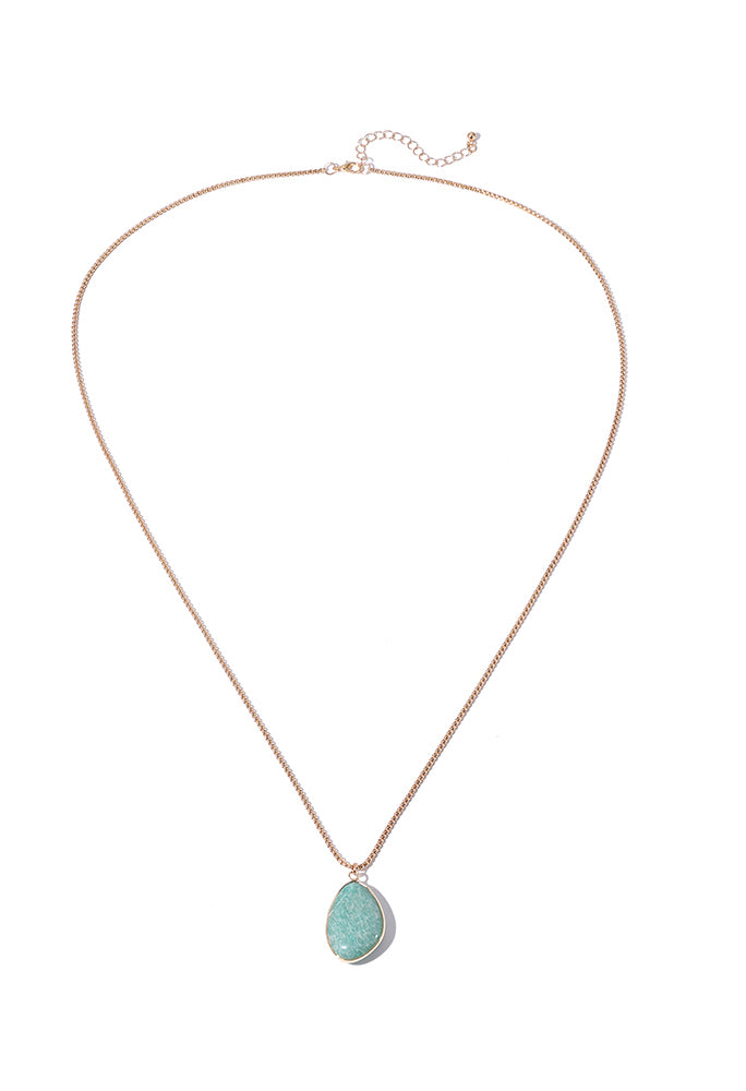 Necklace with a green teardrop pendant on a white background