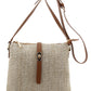 Beige woven handbag with brown leather straps on a white background