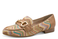 Loafer shoe with patterned strap and brown leather accents on a white background