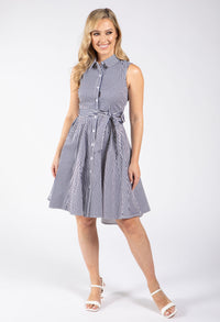 Woman wearing a sleeveless striped dress on a white background