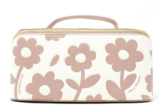 Floral-patterned cosmetic bag with a handle on a white background