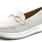 White loafer shoe with a decorative gold emblem on a white background