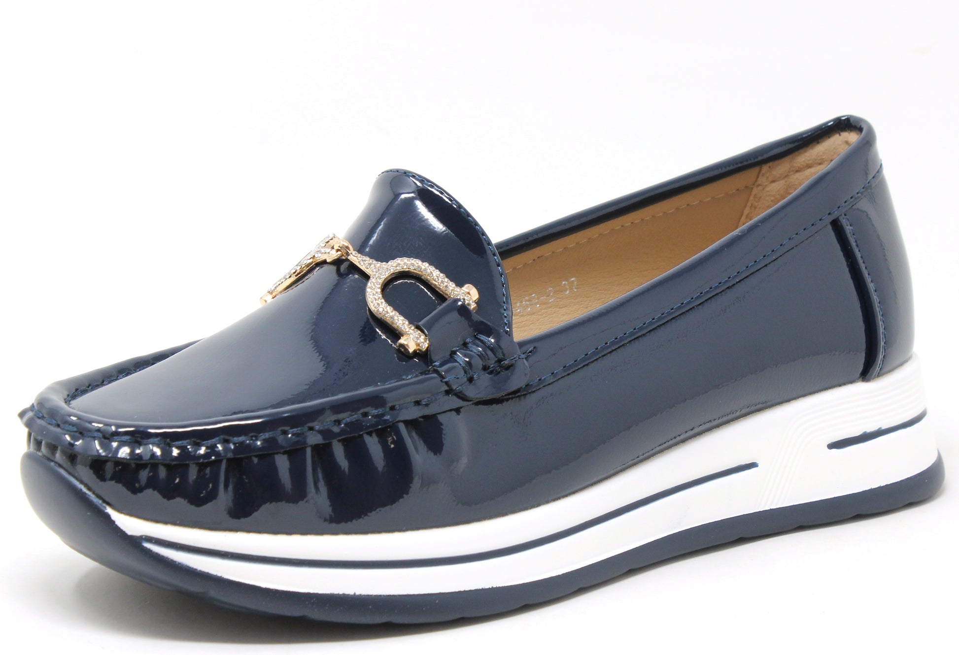 Navy blue patent leather loafer with a white sole on a white background