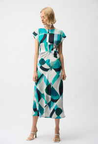 Woman wearing a patterned dress on a white background