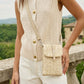 Person wearing a beige knitted vest with a matching crossbody bag, standing outdoors.