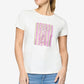 Woman wearing a white t-shirt with a colorful graphic design on a plain background