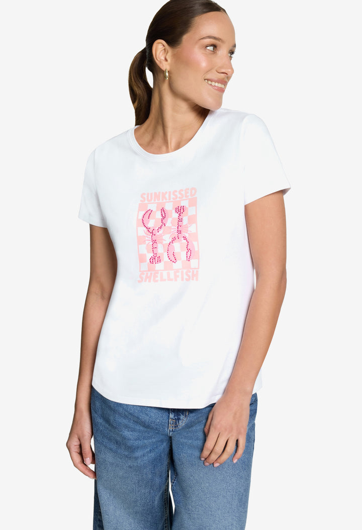 Woman wearing a white t-shirt with pink graphic design on a plain background