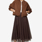 Woman wearing a brown jacket and skirt on a white background
