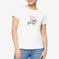 Woman wearing a white t-shirt with a graphic design on a plain background