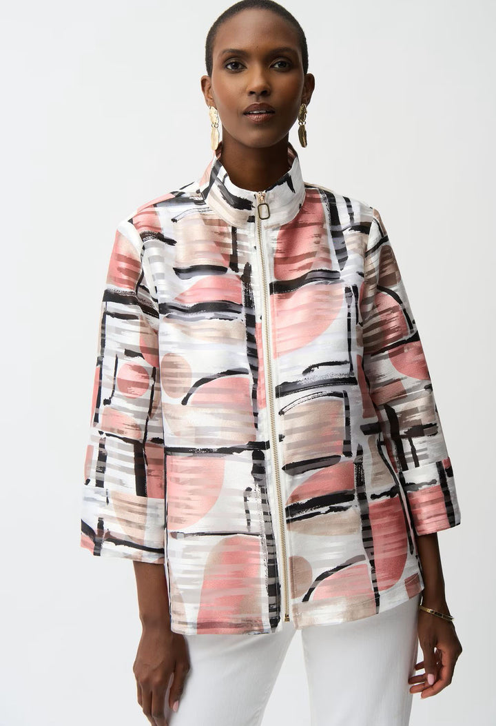 Woman wearing a colorful abstract patterned jacket on a white background