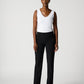Woman wearing a white sleeveless top and black pants on a white background