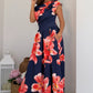 Three-quarter view of Betty midi dress showing asymmetric neckline and short sleeve