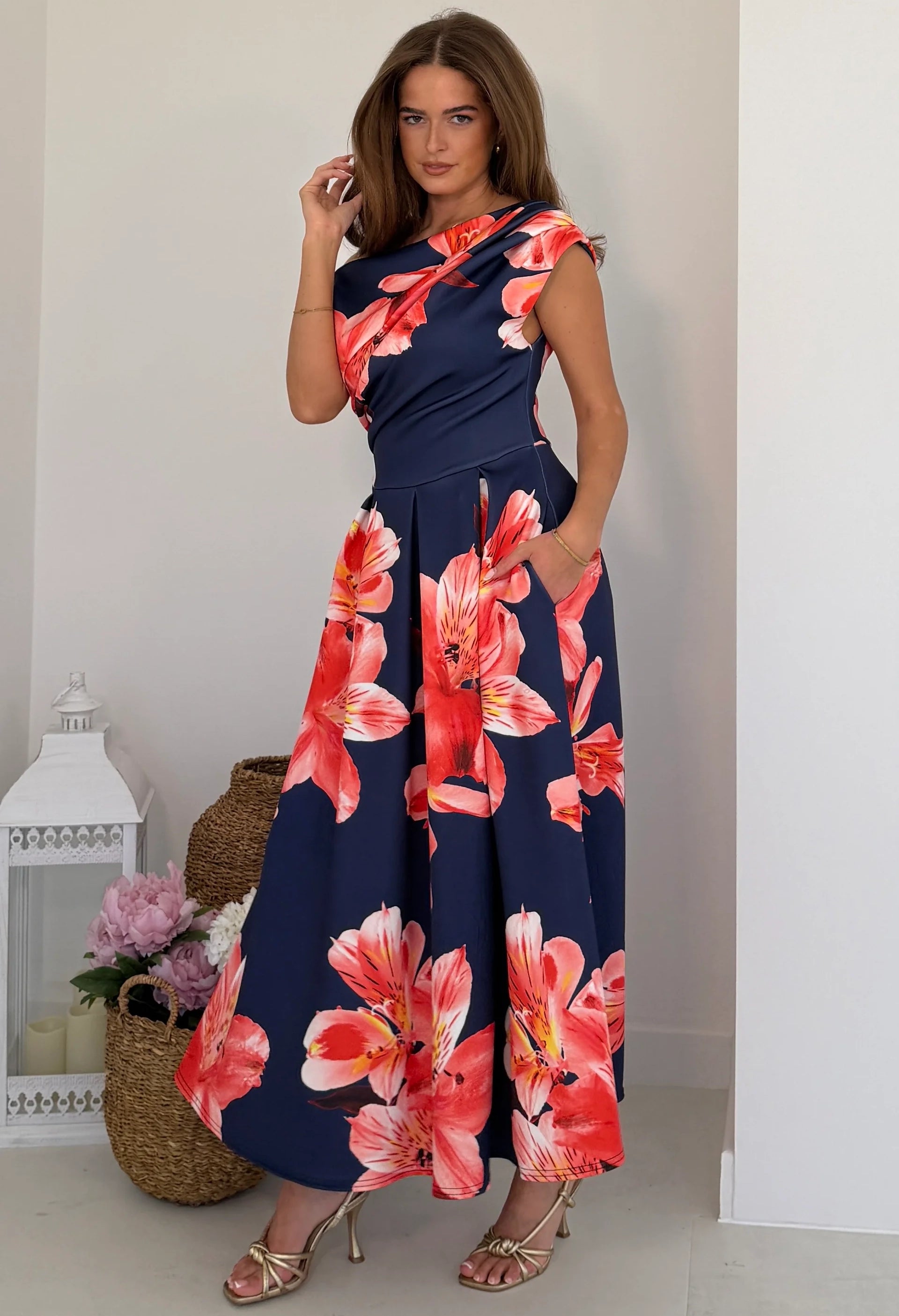 Three-quarter view of Betty midi dress showing asymmetric neckline and short sleeve