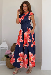 Three-quarter view of Betty midi dress showing asymmetric neckline and short sleeve