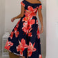 Model wearing Betty asymmetric floral midi dress, showing fit and length