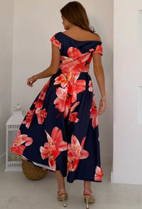 Model wearing Betty asymmetric floral midi dress, showing fit and length