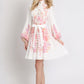 Woman wearing a floral dress on a white background
